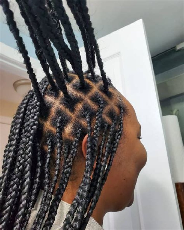 "They Charge N217k": Canada-based Man Braids Wife's Hair Himself Due to High Cost of Salon Visit